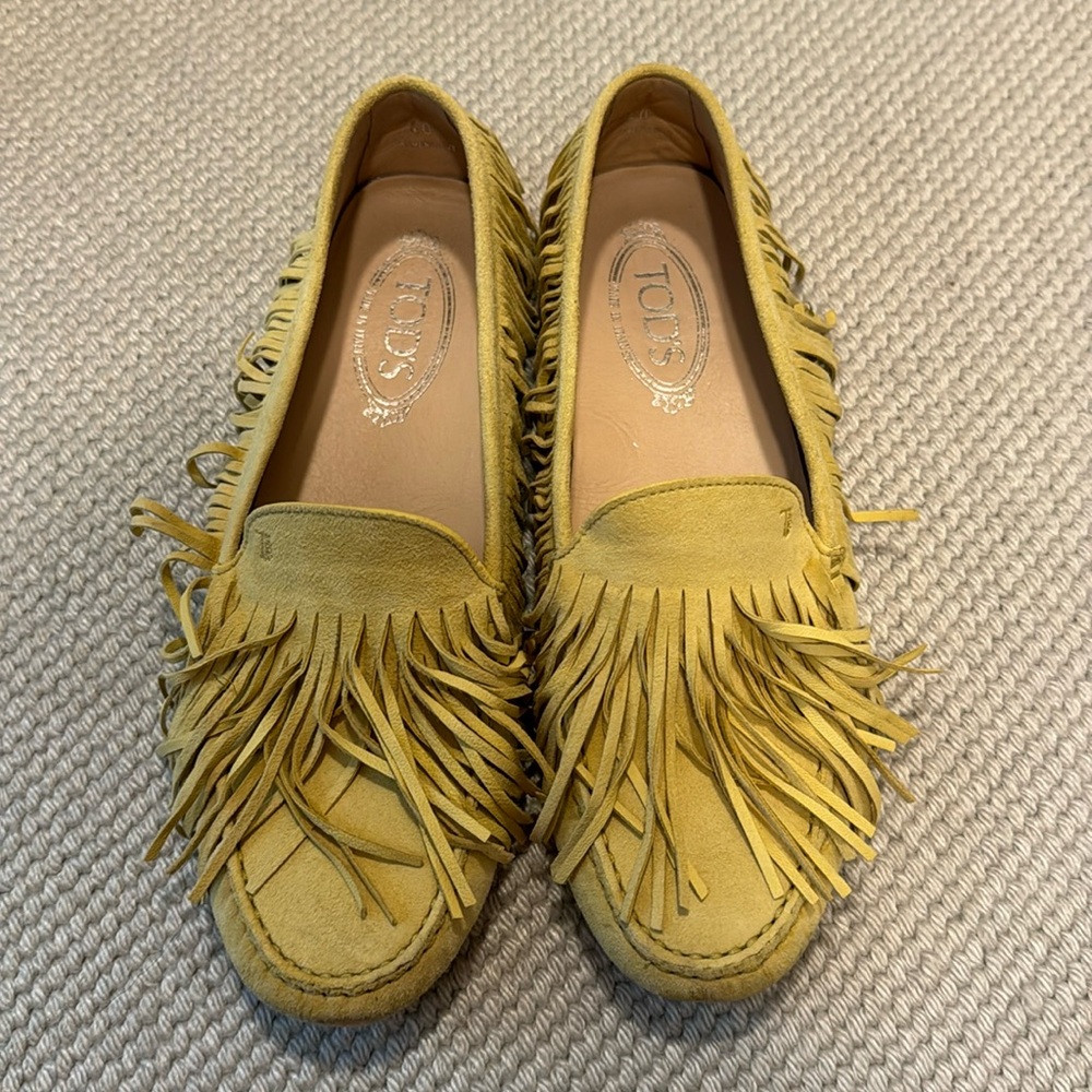 Women’s Tod’s bohemian style with fringe.